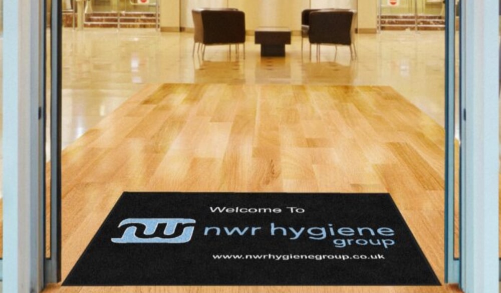 Branded floor protection mat in entrance way