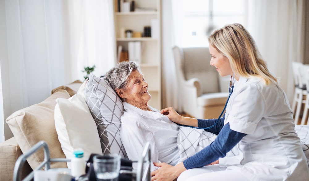 Patient and healthcare worker in care home facility 