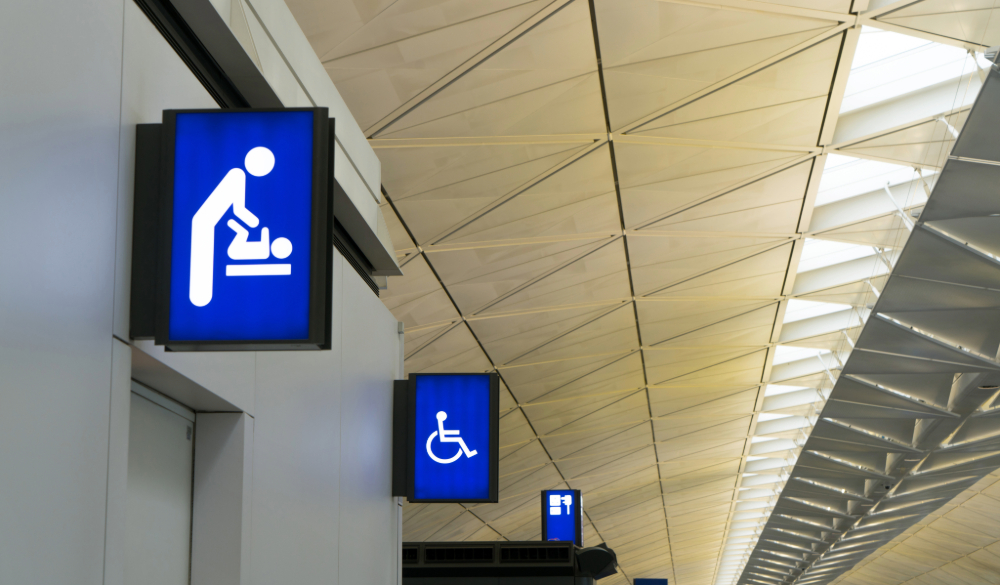 Sign for baby changing facilities in airport.