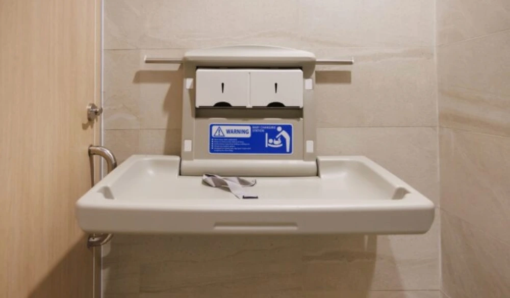 NWR Hygiene’s commercial baby changing unit mounted to a washroom wall