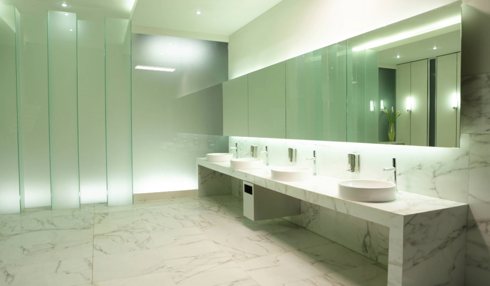 Hotel washroom in the reception area shows a tiled bathroom with sinks