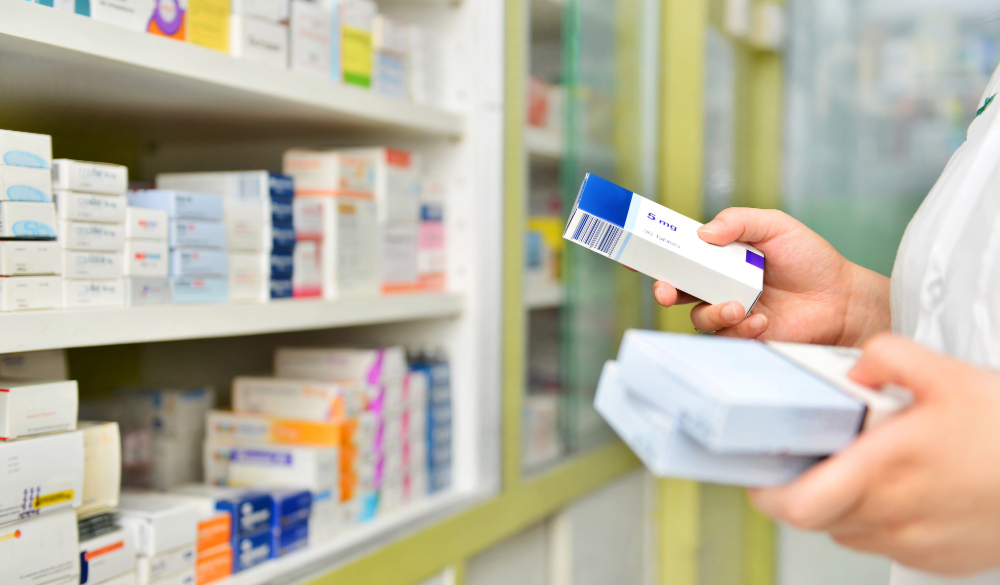 The inside of a pharmacy with medication on shelves.