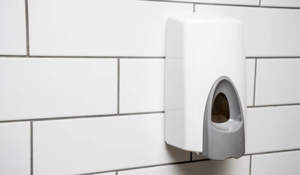 NWR Hygiene’s luxury foam soap dispenser is fitted to a tiled washroom wall.