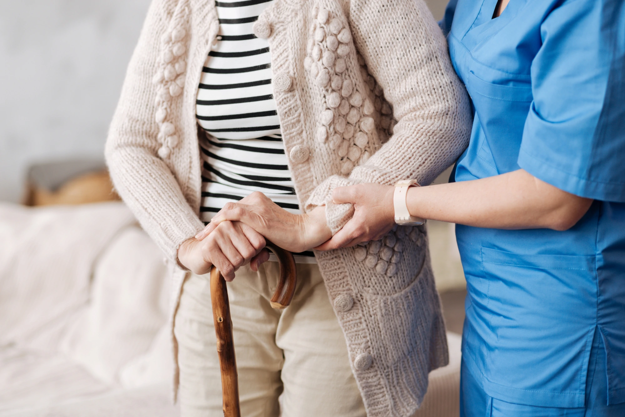 Nurse takes care of old patient.